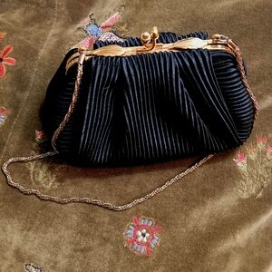 Chic Black Pleated Clutch with Gold Accents